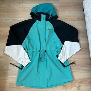 Outdoor Afro x REI Co-op Shell Jacket Green And Black rain jacket
